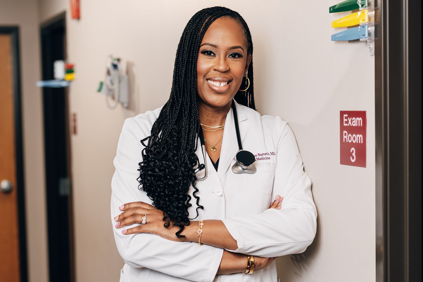 Dr. Standifer-Barrett in her white coat in clinic